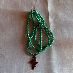 Green Beaded Necklace with Carved Pendant